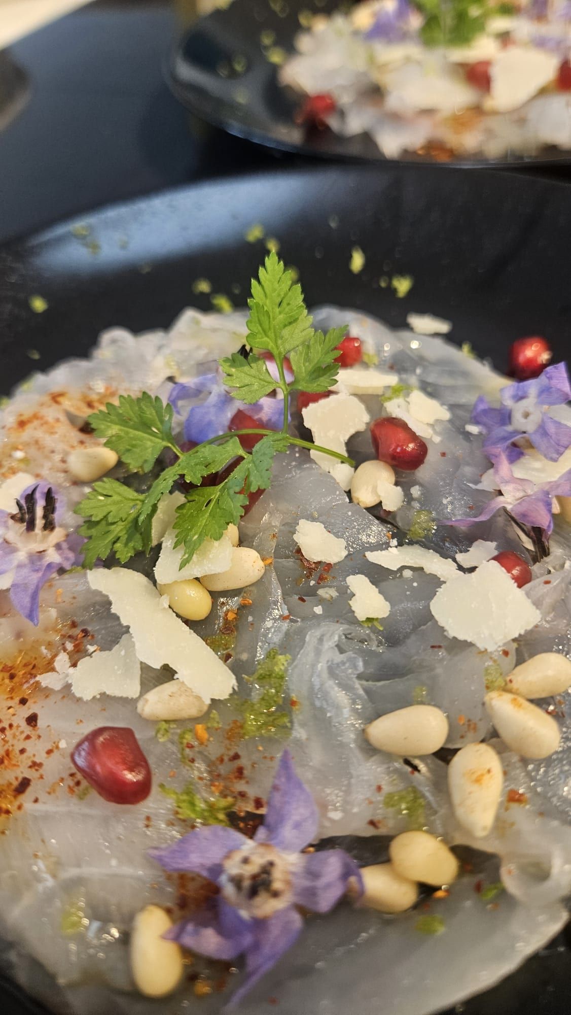 Vegetable salad with edible flowers.